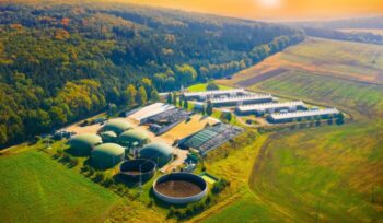 Biogas plant in agricultural landscape.