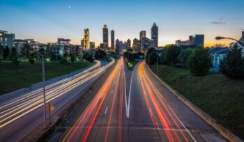 Blur of traffic lights in front of city skyline