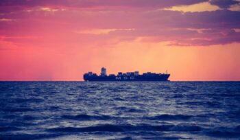 Cargo ship at sunset