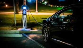 Electric car charging at night