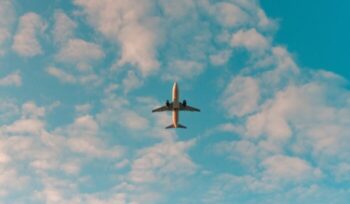 Flying airplane viewed from below