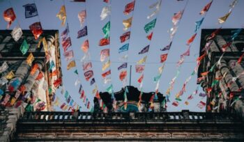 Mexican church with colorful flags