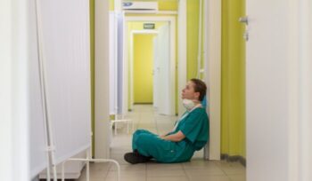 Nurse sitting on the ground