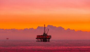 Offshore oil rig at sunset