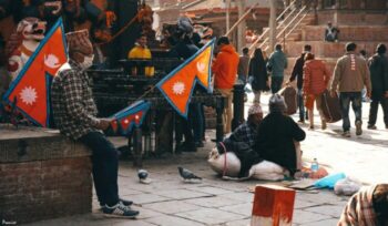 People holding Nepalese flags|Prayer flags e