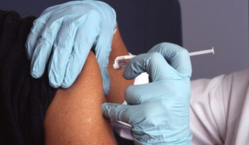 Person receiving a vaccine