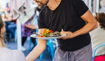 Server at a restaurant|bimo luki unsplash