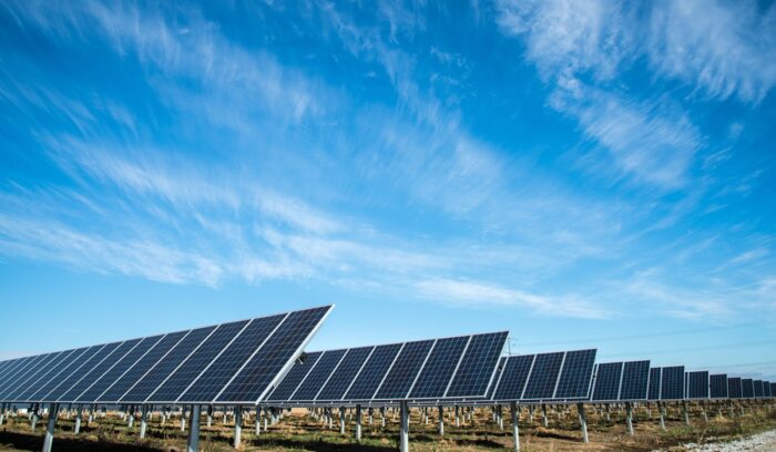 Solar farm with blue sky above