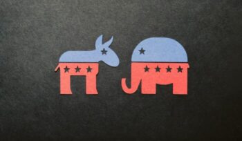 Symbols of Democrat and Republican parties cut out of paper