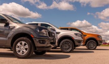 Three Ford cars