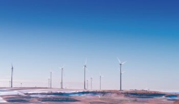 Wind turbines in snowy field