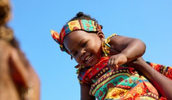 Holding a smiling baby