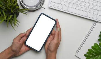 Hands holding a blank smart phone